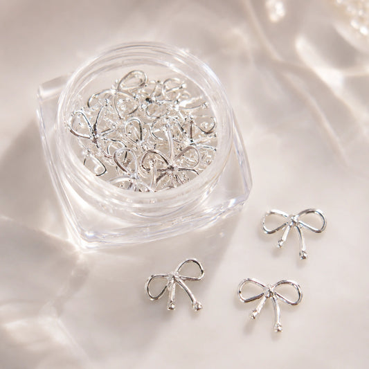 Srebrne metalowe kokardki 3D do zdobienia paznokci Premium Nails