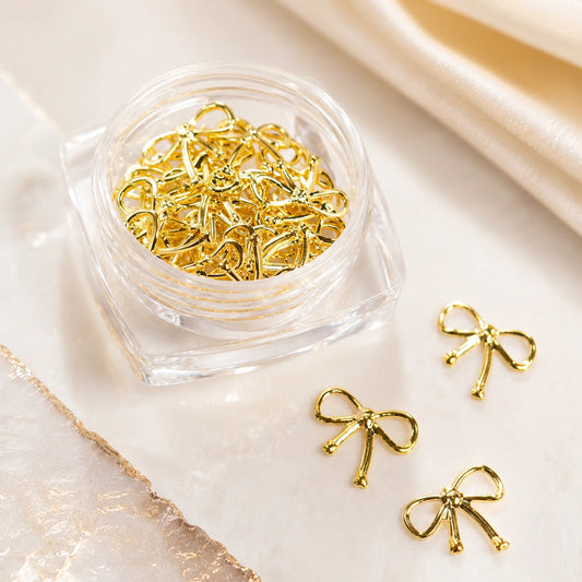 Złote metalowe kokardki 3D do zdobienia paznokci Premium Nails